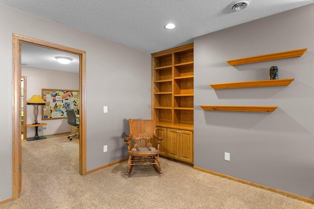 sitting room with recessed lighting, visible vents, light carpet, a textured ceiling, and baseboards