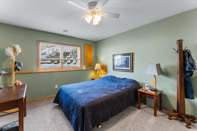 bedroom with visible vents, light carpet, ceiling fan, a textured ceiling, and baseboards