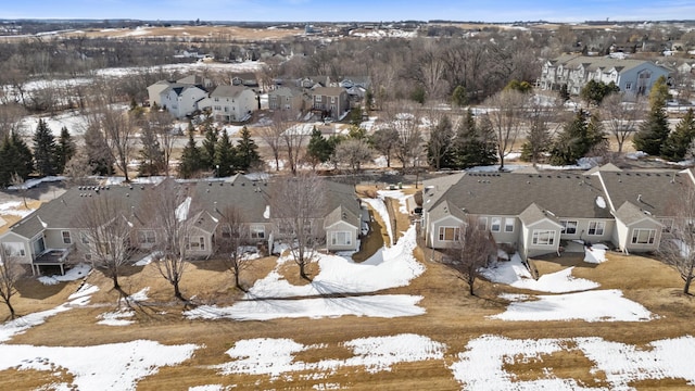 snowy aerial view with a residential view