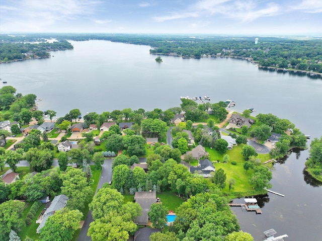 aerial view of residential area featuring a nearby body of water