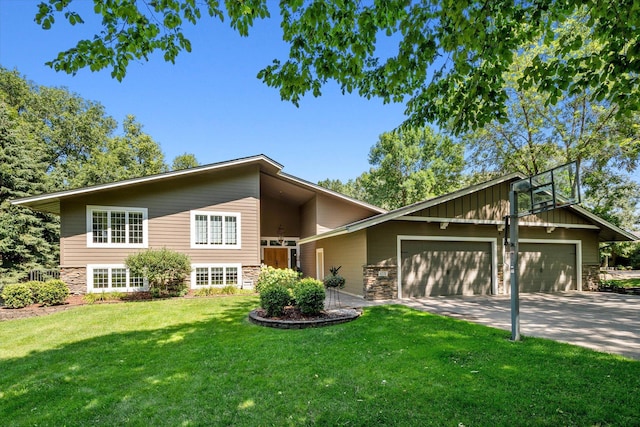 mid-century home featuring a garage, a front yard, concrete driveway, stone siding, and board and batten siding