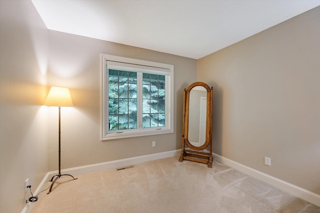 empty room with baseboards and carpet floors