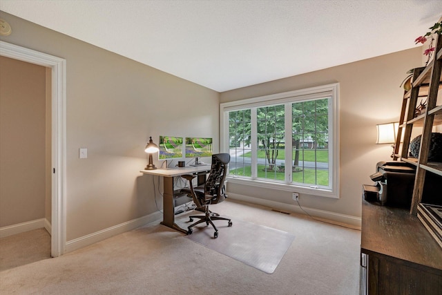 home office featuring carpet floors and baseboards