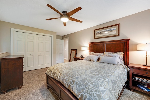 bedroom with carpet flooring, a closet, and ceiling fan