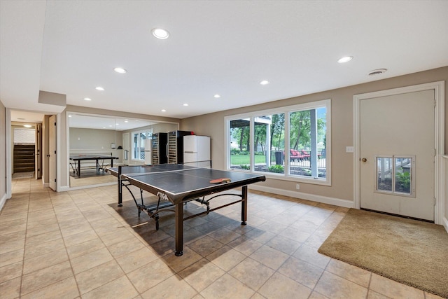game room featuring recessed lighting, baseboards, and light tile patterned flooring