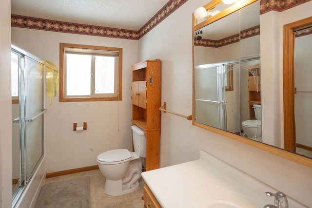 full bath with a textured ceiling, vanity, toilet, and baseboards