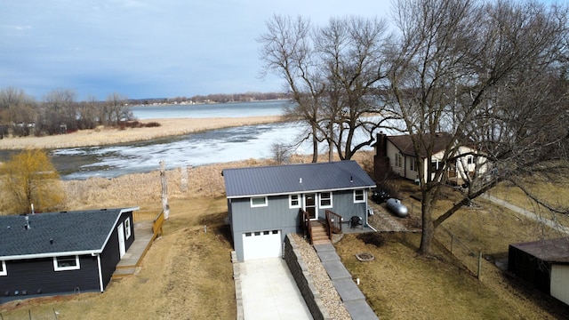birds eye view of property with a water view