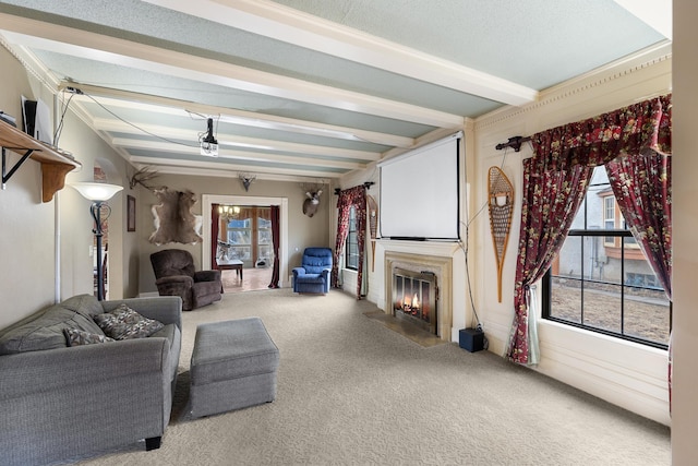 living room featuring a fireplace with flush hearth, beam ceiling, and carpet flooring