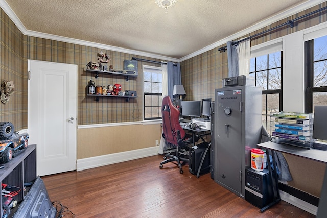 home office with a textured ceiling, ornamental molding, wood finished floors, and wallpapered walls