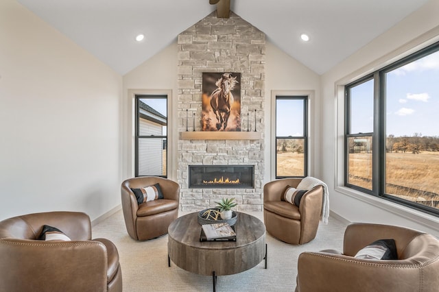 carpeted living room featuring high vaulted ceiling, a fireplace, beam ceiling, and baseboards