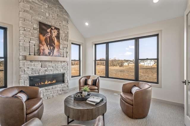 carpeted living room with lofted ceiling, a fireplace, baseboards, and recessed lighting