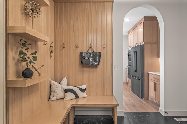 mudroom with arched walkways