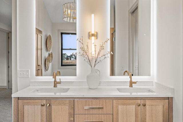 bathroom featuring double vanity and a sink