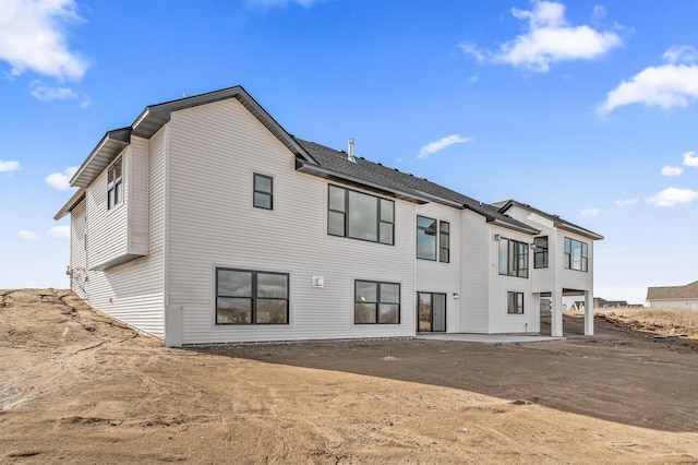 back of property featuring a patio