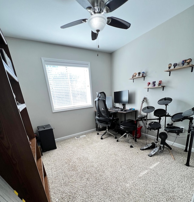 office with carpet, visible vents, baseboards, and ceiling fan