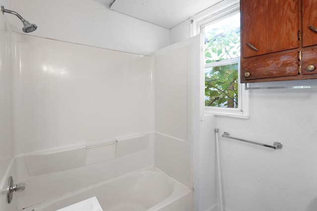 bathroom featuring  shower combination