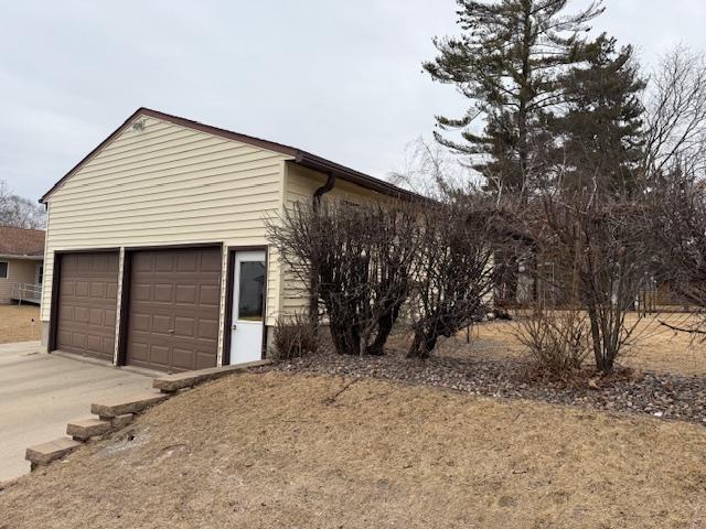 garage featuring driveway