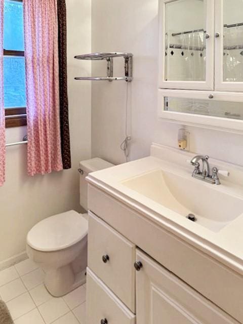 full bath with tile patterned flooring, toilet, and vanity