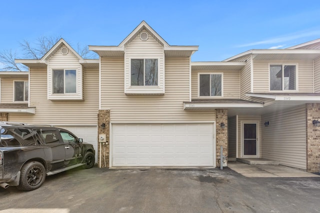 view of front of home with an attached garage and driveway