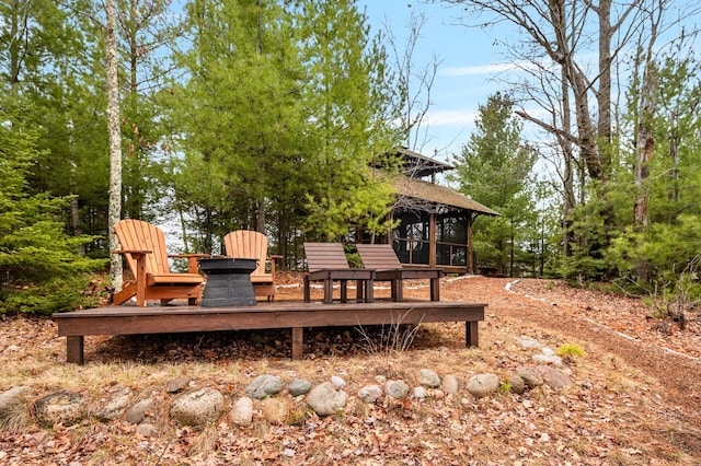 wooden deck with a sunroom
