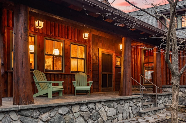 entrance to property featuring covered porch