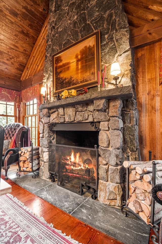 detailed view of wood finished floors, a fireplace, and wood ceiling