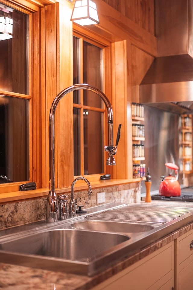 kitchen view of bar area and white cabinetry