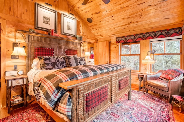 bedroom with wooden ceiling, wood finished floors, wood walls, and lofted ceiling