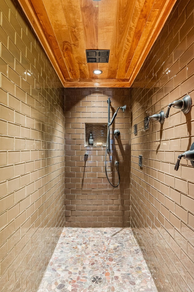 full bathroom featuring wooden ceiling and a tile shower