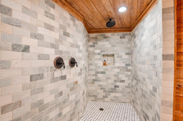 bathroom with wood ceiling, a tile shower, and recessed lighting