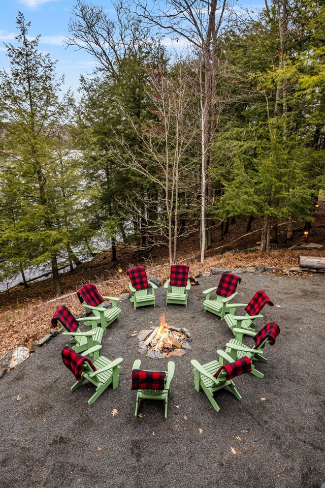 view of yard with an outdoor fire pit
