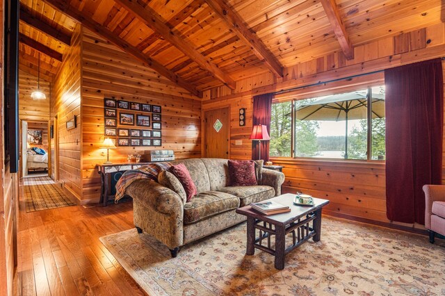 living room with wood ceiling, wood-type flooring, and wood walls