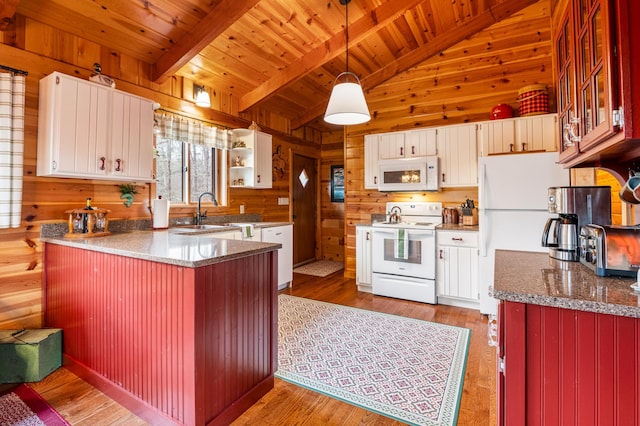 kitchen featuring white appliances, wood ceiling, wooden walls, a peninsula, and hanging light fixtures