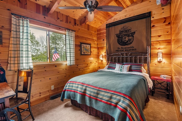bedroom with carpet, wooden walls, and wooden ceiling