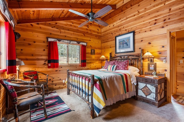 carpeted bedroom featuring wooden walls and wood ceiling