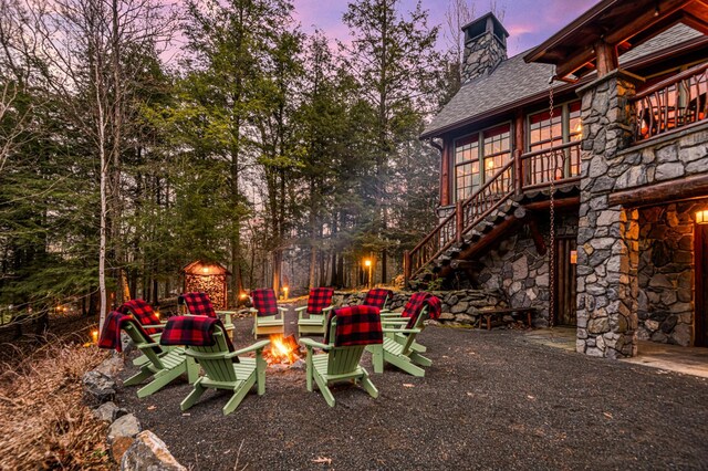 view of yard featuring stairs and a fire pit