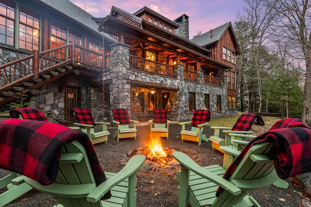 patio / terrace with an outdoor fire pit