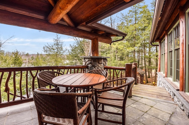 wooden terrace with outdoor dining space