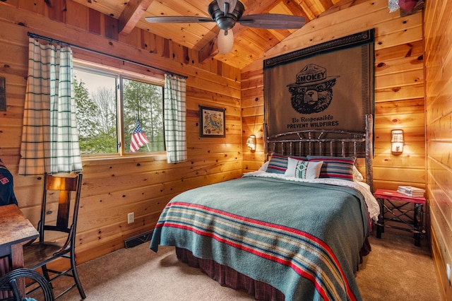bedroom with carpet, wooden walls, and wooden ceiling