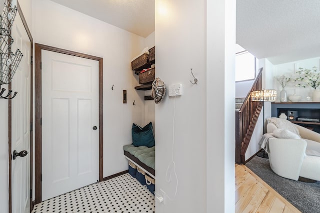 mudroom with light wood-style flooring