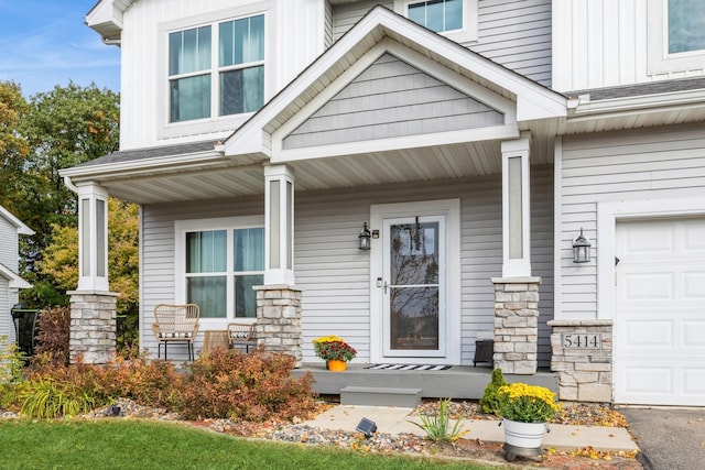 entrance to property with covered porch and board and batten siding