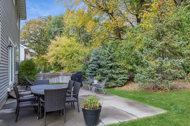 view of patio / terrace with outdoor dining area and fence