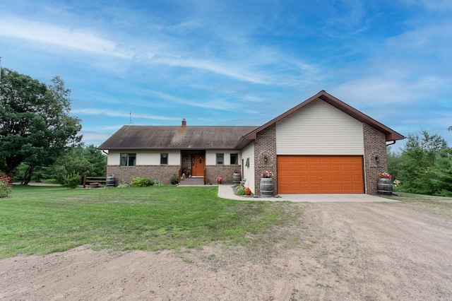 ranch-style home featuring a front lawn, brick siding, driveway, and an attached garage