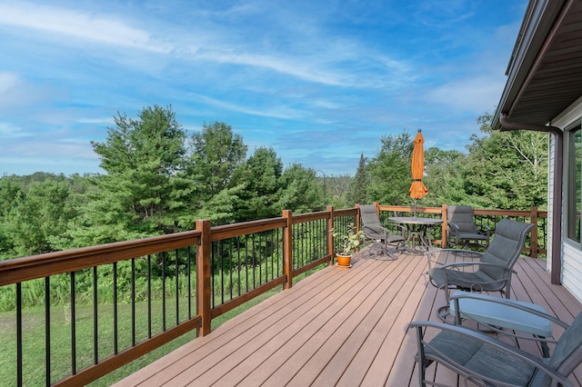 deck featuring outdoor dining area