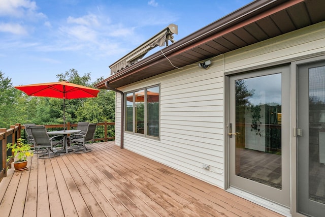 deck featuring outdoor dining area