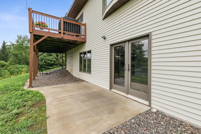 view of patio featuring french doors and a wooden deck