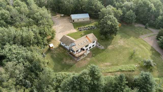 birds eye view of property with a wooded view and a rural view