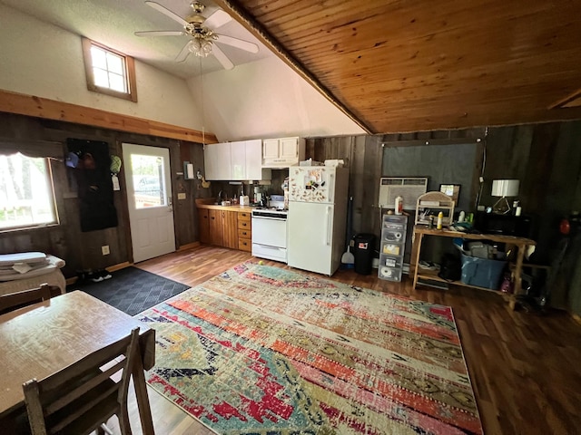 kitchen featuring light wood-style flooring, white appliances, white cabinets, ceiling fan, and vaulted ceiling