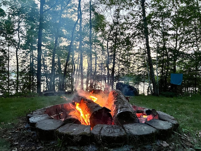 view of yard with a fire pit