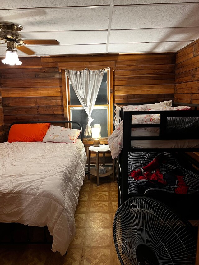 bedroom with wooden walls